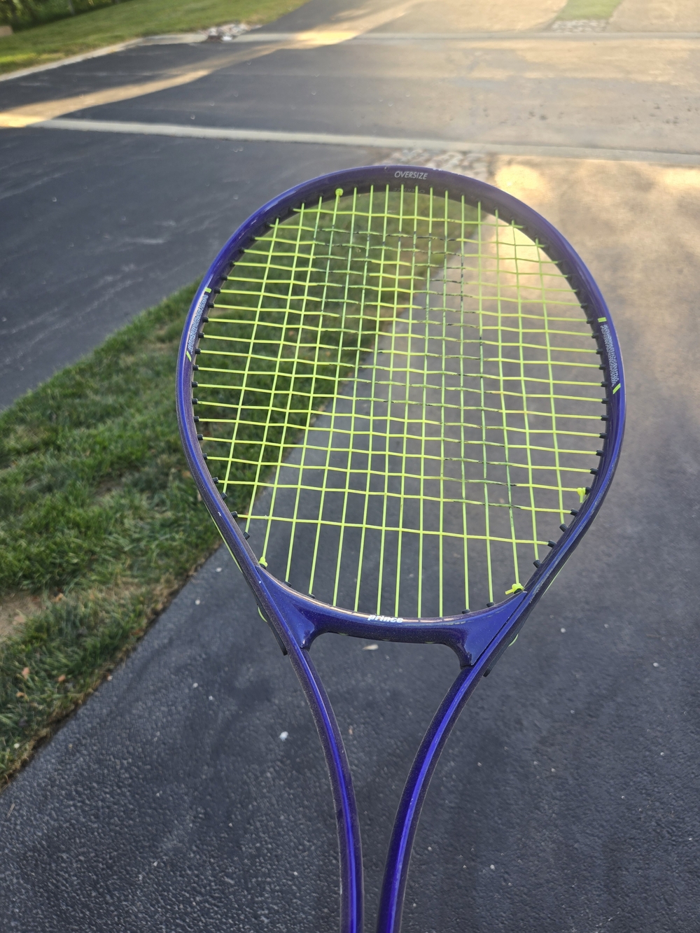Prince Purple Tennis Racket with Neon Yellow Strings